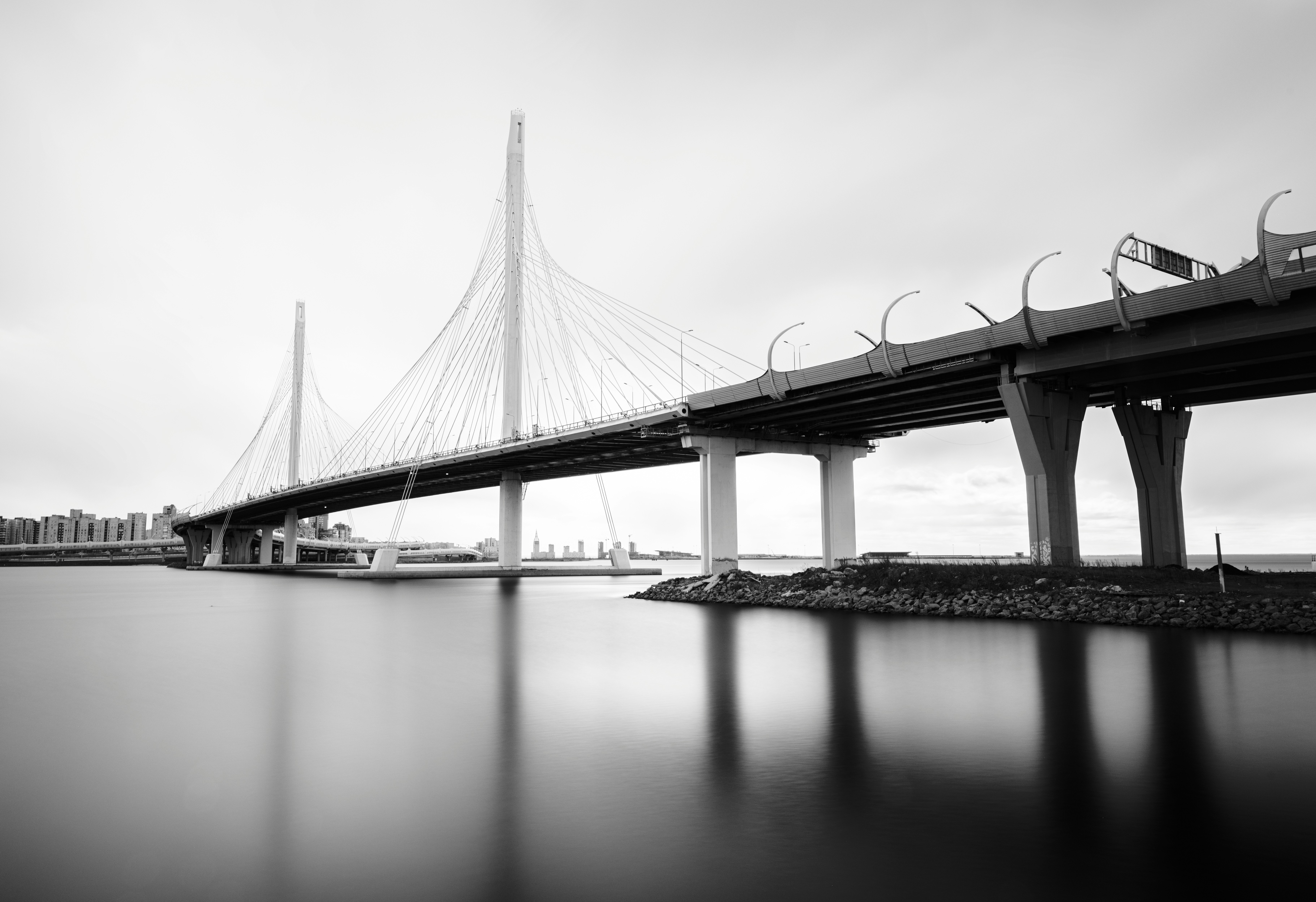 Modern bridge over calm water